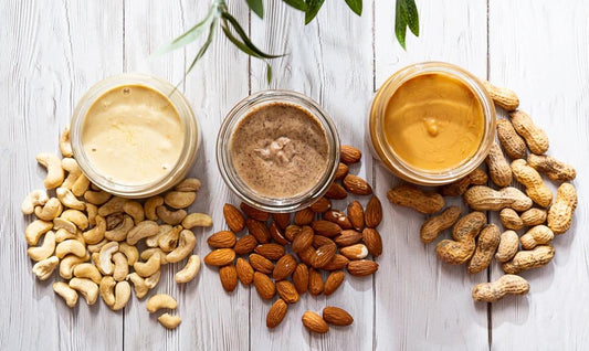 Homemade cashew, almond and peanut butter with whole nuts