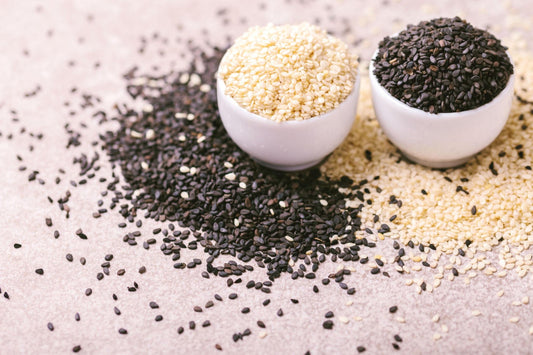 Black and white sesame seeds in bowls