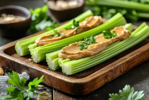Nut butter for keto with celery sticks and almond butter