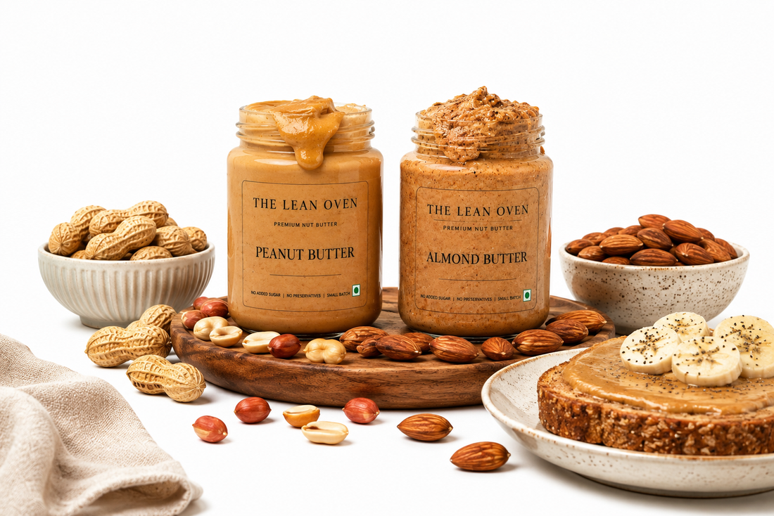 The Lean Oven peanut butter and almond butter jars with banana toast, peanuts, and almonds showing a protein-rich nut butter comparison.