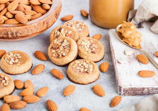 Sugar-free cookies served with natural peanut butter as a healthier dessert option.
