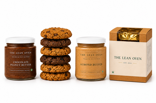 Jars of chocolate and almond butter with cookies and a box on a white background