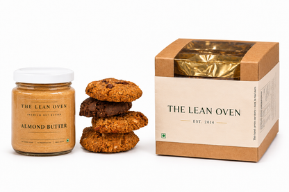 Jar of almond butter, stack of cookies, and box from 'The Lean Oven' on a white background